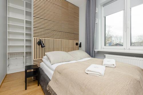 Posteľ alebo postele v izbe v ubytovaní Artistic Żoliborz Apartments by Noclegi Renters