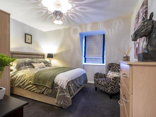 a bedroom with a bed with a horse head on the ceiling at Luxury Living Cathedral Quarter Cafes Bars in Belfast