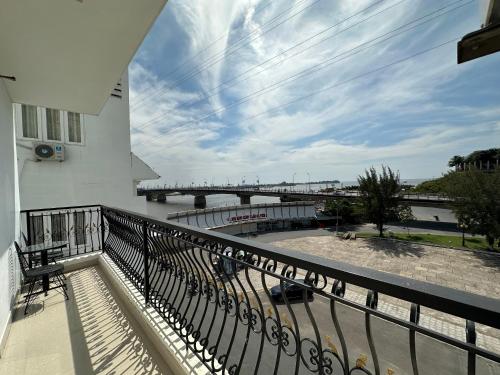 a balcony with a view of a river and a bridge at Bao Chieu Inn in Ha Tien