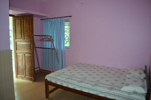 Ліжко або ліжка в номері Vailankanni Guesthouse