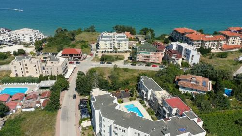 an aerial view of a resort next to the water at Sunny House in Byala