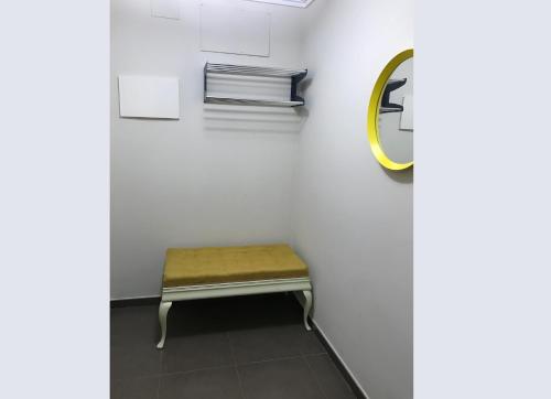 a bench in a white room with a mirror at Stunning 2-Bed Apartment in Pego in Pego