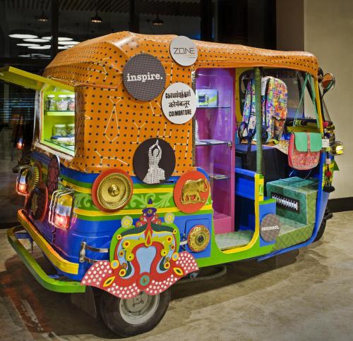 a brightly colored van with stickers on the back at Zone By The Park Coimbatore in Coimbatore