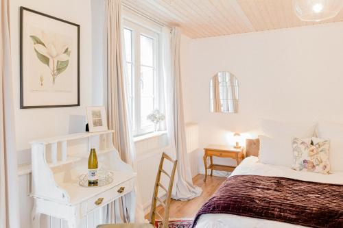 Una cama o camas en una habitación de Die Talmühle