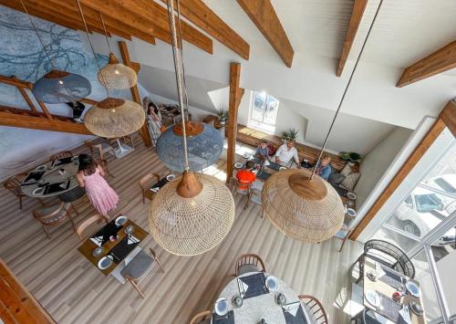 an overhead view of a living room with people sitting at tables at Swakopmund Luxury Suites in Swakopmund