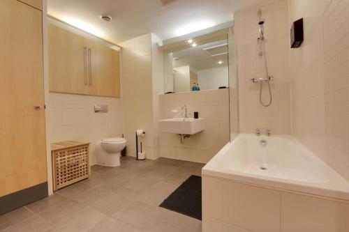 a bathroom with a tub and a sink and a toilet at Home Away From Home - Contractors & Leisure in Sheffield