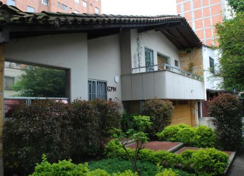 a building with a balcony on the side of it at CASA DE LOLA in Medellín