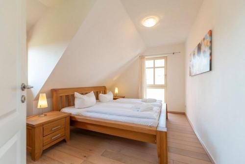 Katil atau katil-katil dalam bilik di Ferienhaus Karnin A
