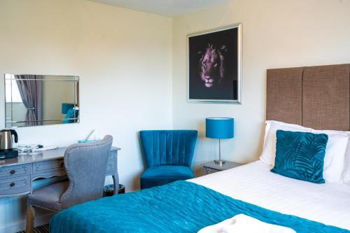 Postel nebo postele na pokoji v ubytování White Lion Hotel