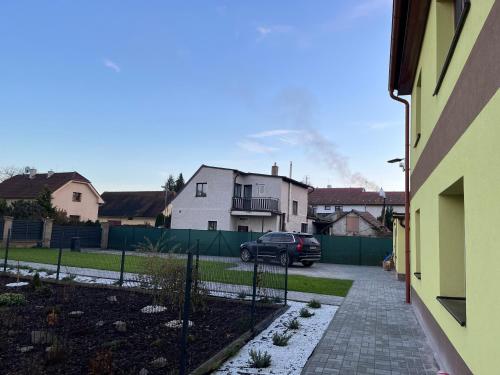 a car parked in the driveway of a house at Apartment Golden Prague 78 in Vestec