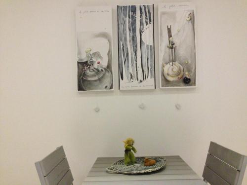 a table with two chairs and a plate on it at B&B Il Piccolo Principe room and breakfast in Bieno