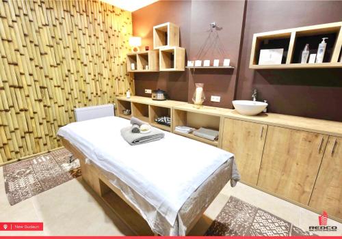 a hospital room with a bed and a sink at New Gudauri 312 in Gudauri
