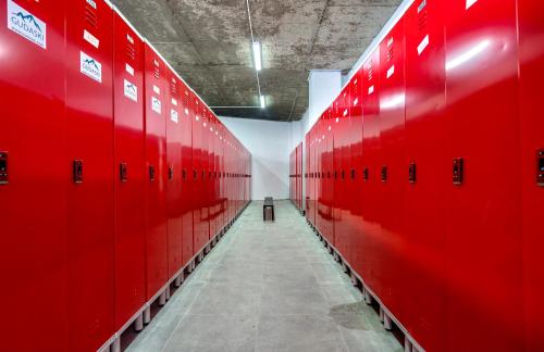 a row of red lockers in a gym at New Gudauri 312 in Gudauri