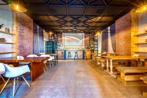 a restaurant with tables and chairs and a bar at New Gudauri 312 in Gudauri