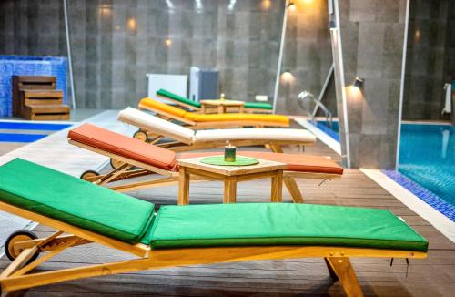 a group of chairs and a table and a pool at New Gudauri 312 in Gudauri