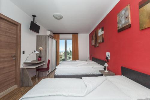 Postel nebo postele na pokoji v ubytování Hotel Garni Ischia