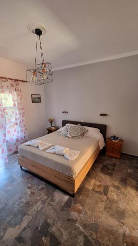 a bedroom with a large bed in a room at Anna Garden Sidari in Sidari
