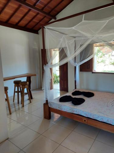 Giường trong phòng chung tại Sem Fronteiras