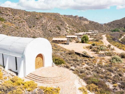 a white chapel in the middle of a mountain at AfriCamps at Karoo 1 in De Doorns