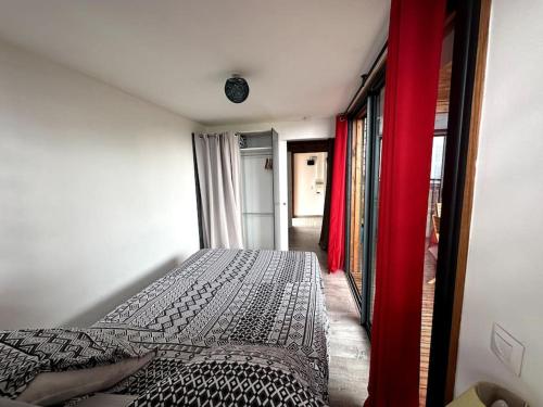 En eller flere senge i et værelse på KAZA-Nounours Location saisonnière
