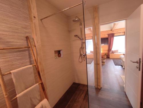 a bathroom with a shower with a glass door at Laganini Country in Samobor