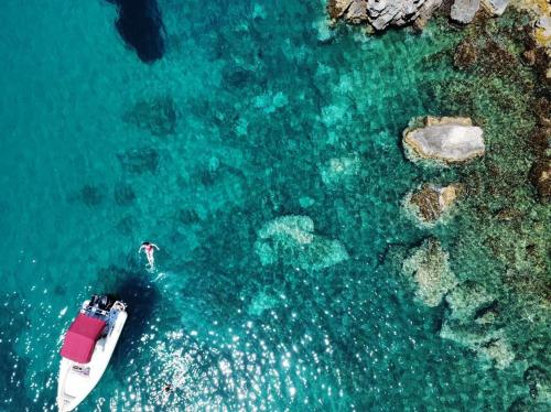 an aerial view of a boat in the water at Villa Vrachos luxury Living in Vrachos