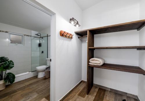 a bathroom with a shower and a toilet at Casa Isleña in Rincon