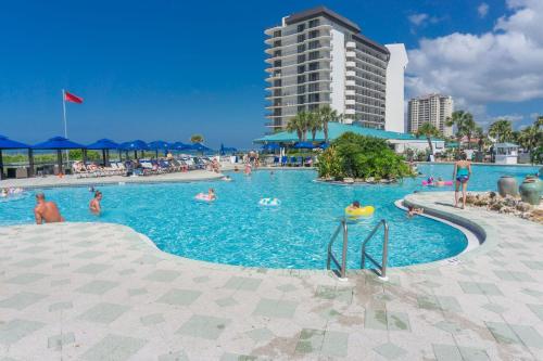 a large swimming pool with people in the water at Edgewater Beach & Golf Resort by Panhandle Getaways in Panama City Beach