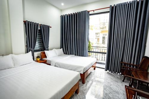 Postel nebo postele na pokoji v ubytování Mini hotel Lạc Hồng