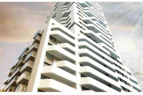 a rendering of a tall white apartment building at New apt in new building located begin of Petrzalka in Bratislava