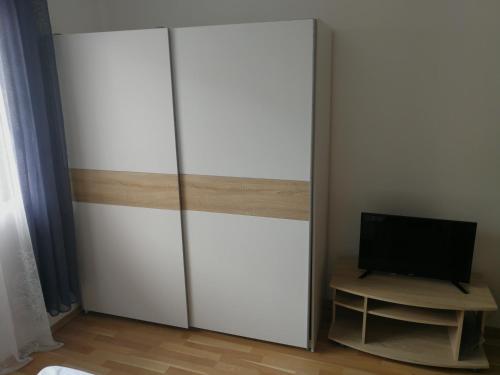 a large white closet with a television on it at VILA RENATA in Grižane