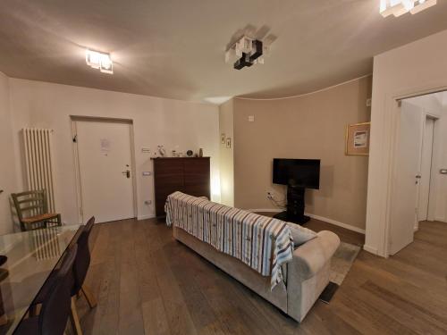 a living room with a couch and a television at La Pieve in Perugia