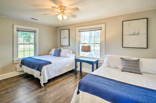 a bedroom with two beds and a ceiling fan at Pet-Friendly Greensboro Vacation Rental! in Greensboro