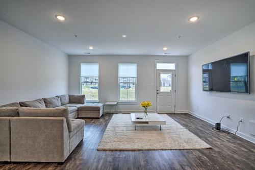 a living room with a couch and a table at Modern Townhome 4 Mi to Downtown Frederick! in Frederick