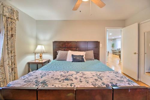 a bedroom with a large bed and a ceiling fan at Cozy Woodbridge Home with Fire Pit and Deck in Woodbridge