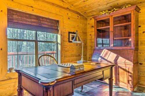 a wooden desk in a room with a window at Pet-Friendly Cabot Cabin with Fenced Yard! in Cabot