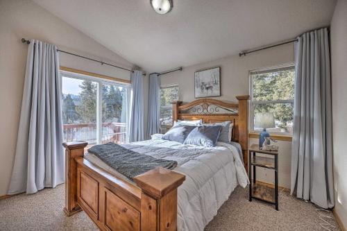 a bedroom with a bed and a large window at Woodland Park Home with Stunning Mountain Views in Woodland Park