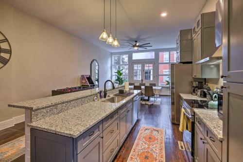 a kitchen with stainless steel appliances and a large counter top at Near Downtown Dayton Historic South Park Home in Dayton