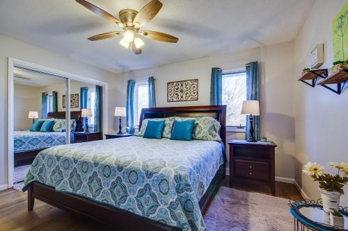 a bedroom with a bed and a ceiling fan at Fulton Vacation Rental 13 Mi to Mizzou! in Fulton