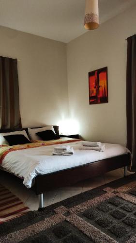 a bedroom with a large bed in a room at Guesthouse Villa Joanna&Mattheo in Sarandë