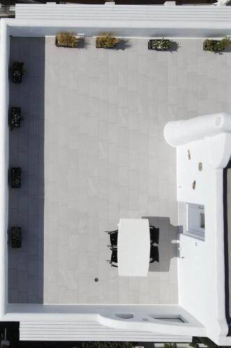 a bathroom with a sink and a toilet in a room at Studios Alsos in Naxos Chora
