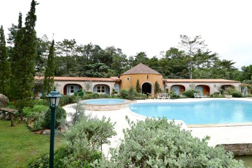 a house with a swimming pool in a yard at Moon River Village in Ban Bu Khanun