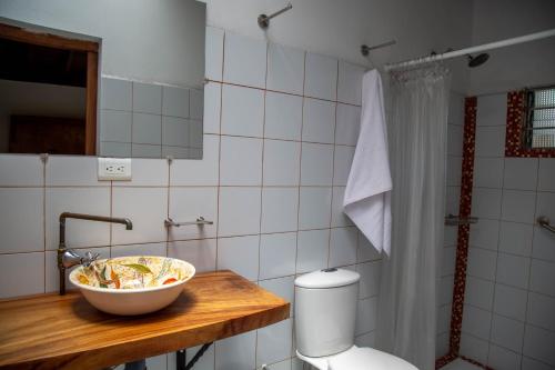 a bathroom with a sink and a bowl on a counter at CASA DE LOLA in Medellín