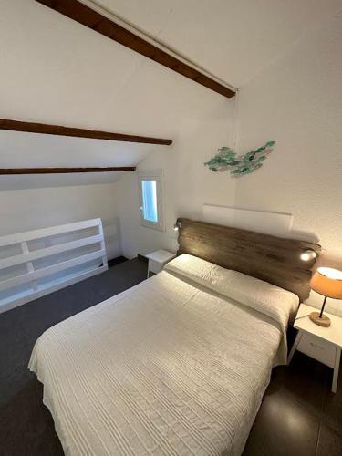 a bedroom with a large bed in a room at Maison D Santa Giulia in Porto-Vecchio