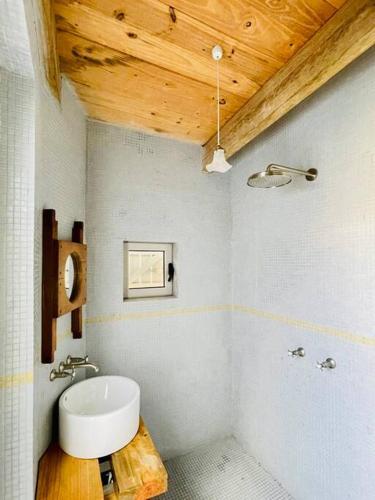 a bathroom with a white toilet and a sink at Dertien in Paternoster