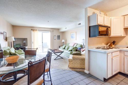 a living room with a kitchen and a living room with a table at Marylander Condominiums, 90 steps from the beach in Ocean City