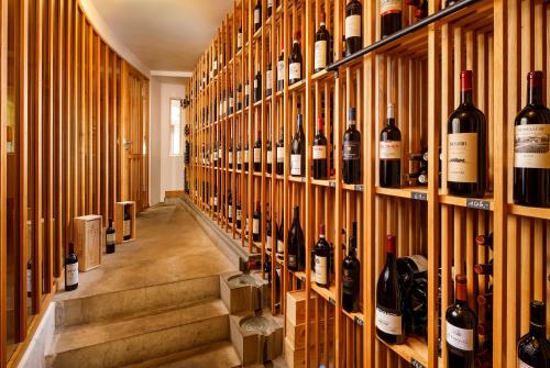 a room filled with lots of bottles of wine at Hotel Restaurant Schiff in Pfäffikon
