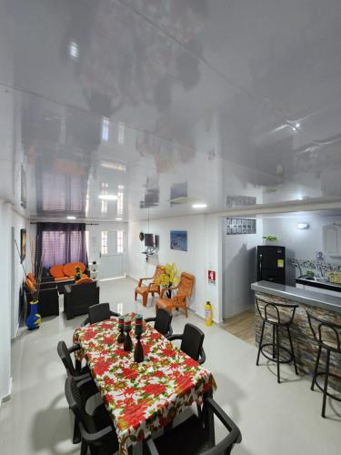 a large living room with a table and a kitchen at ESTRELLA DEL MAR in San Andrés