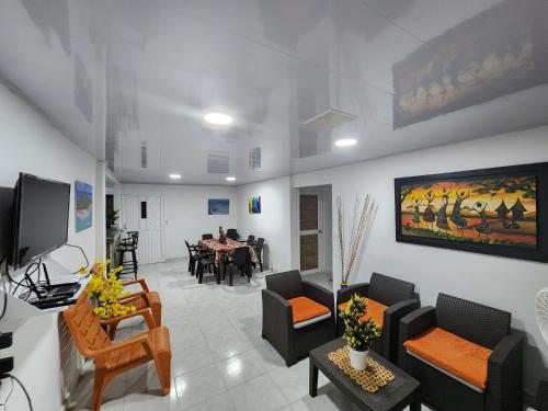 a living room with a table and a dining room at ESTRELLA DEL MAR in San Andrés