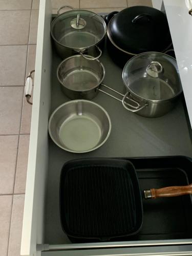 a bunch of pots and pans in a drawer at Ferienhaus Loretto in Wölzing
